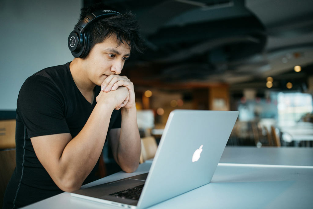 man looking at computer for mcat