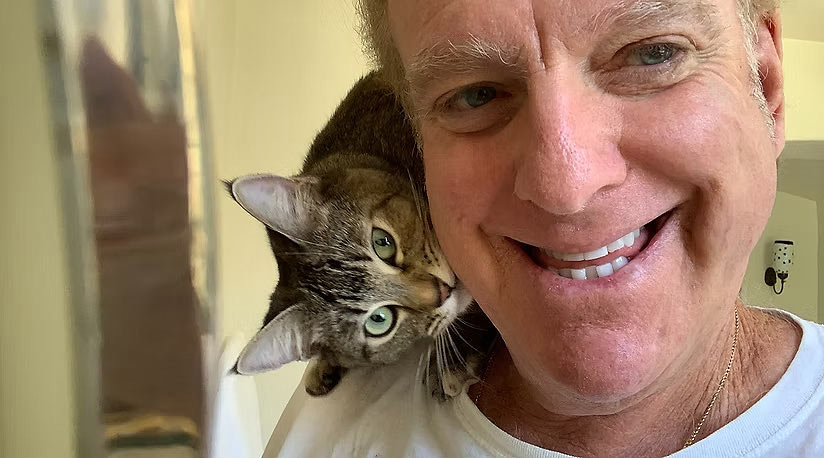 Arthur Von Wiesenberger with cat