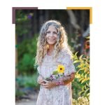 Dina Saalisi with flowers in a garden