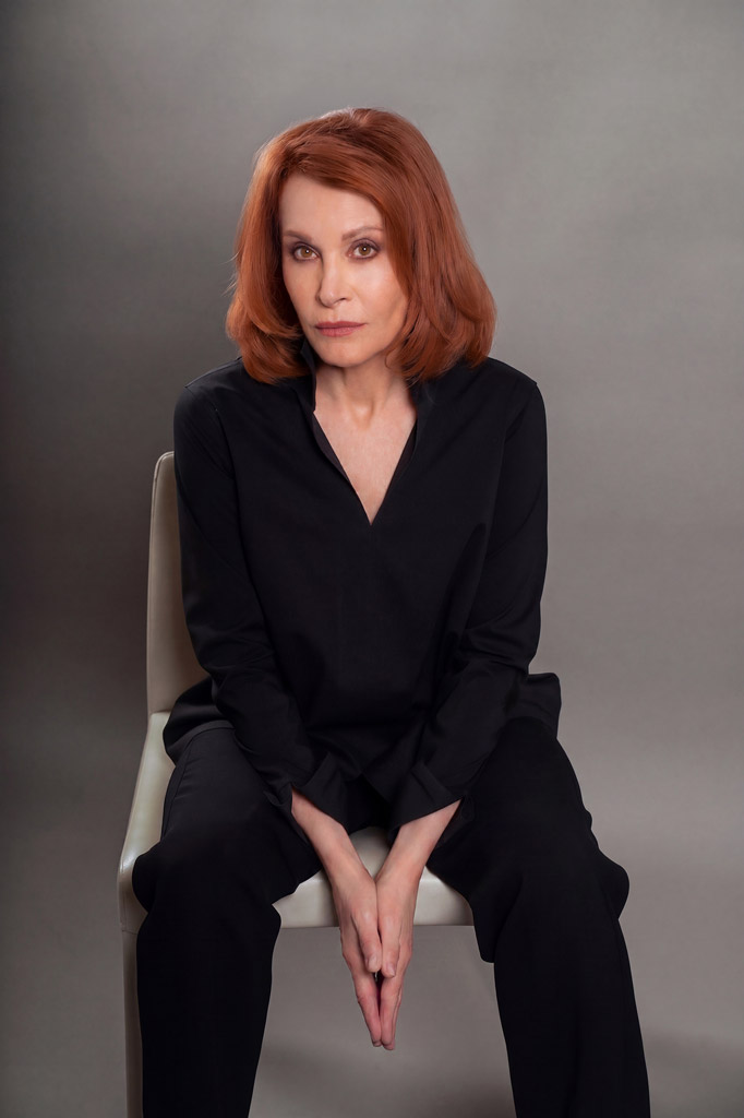 Stefanie Powers sitting on a chair