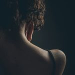 woman with her back turned hurt